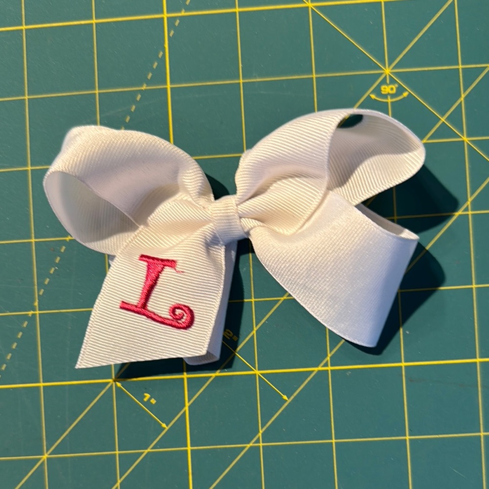 White Bow with Pink Initial “L”